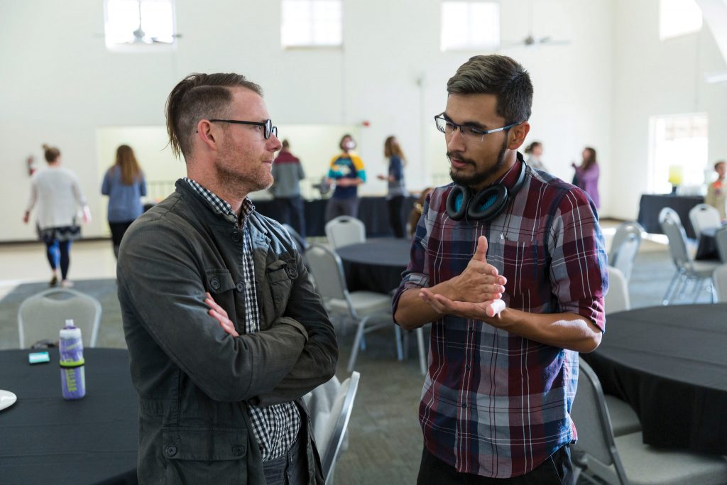 Jonathan Mooney and Nick Rada converse after Mooney's presentation. Mooney visited CI on Feb. 13 in order to discuss his experiences growing up as a child with dyslexia and ADHD. Photo credit to CI Communication and Marketing.