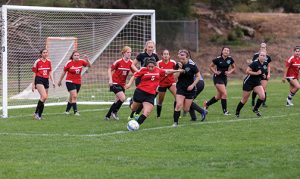 CI Women's Soccer Club play a competitive game. Soccer is a team sport offered at CI as an intramural and club sport. Photo credit to CI Communication and Marketing.