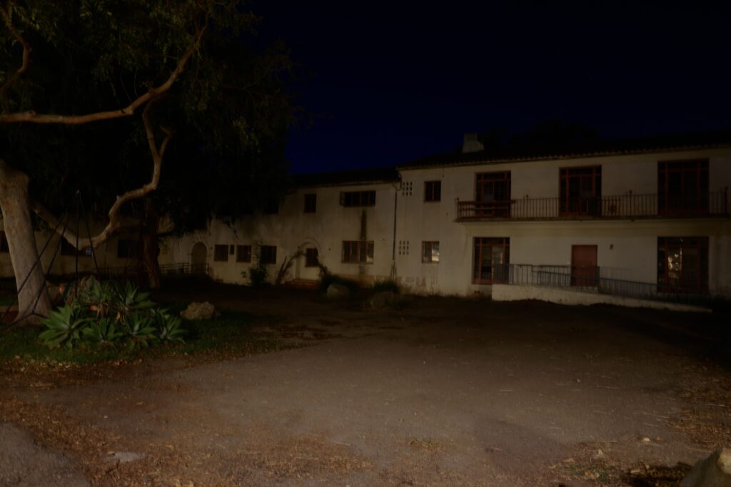 Nighttime photo of abandoned building near Gateway Hall